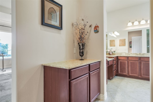 bathroom featuring tile patterned floors and vanity