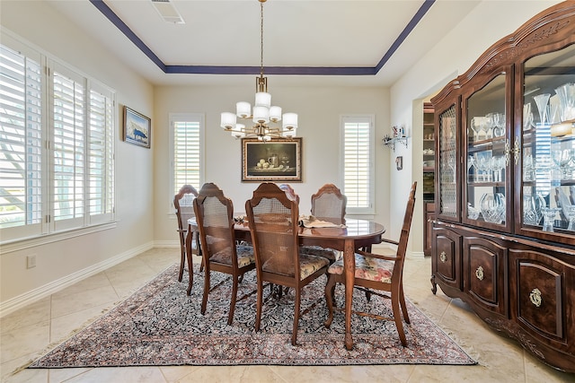 dining room with light tile patterned floors and a chandelier