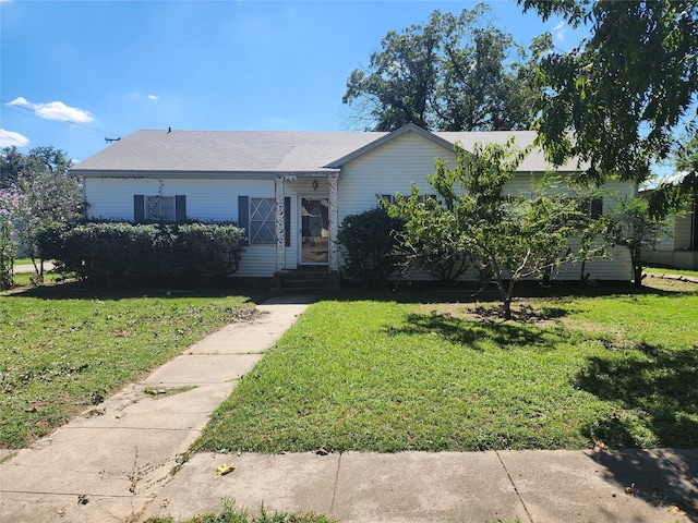 ranch-style home with a front yard