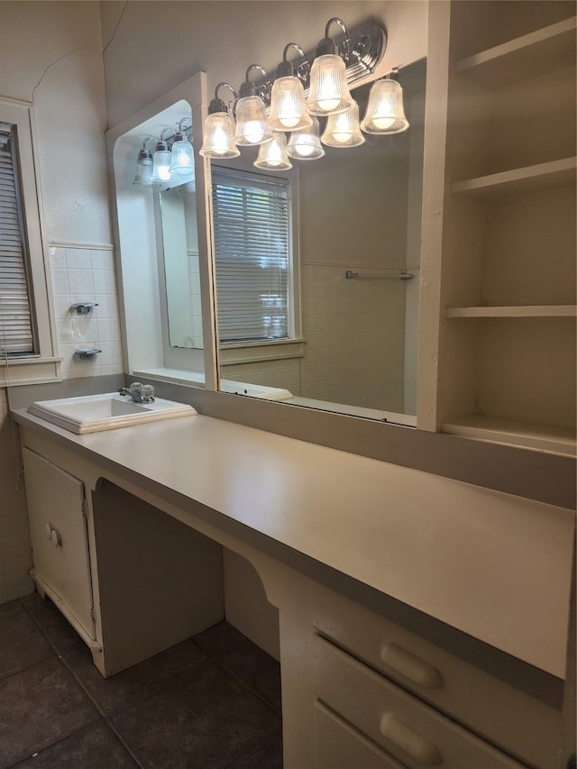 bathroom featuring tile patterned flooring and vanity