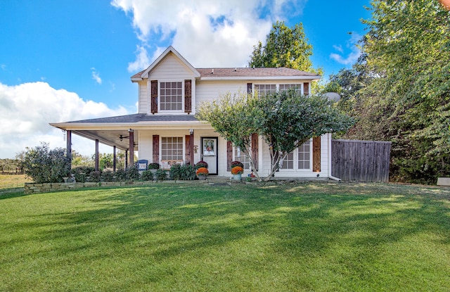 view of front facade featuring a porch, a front lawn, and ceiling fan