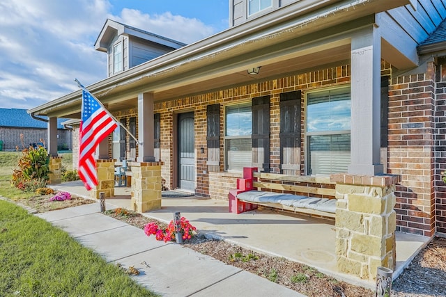 property entrance with covered porch