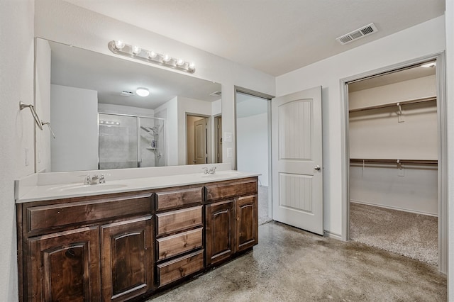 bathroom featuring vanity and walk in shower