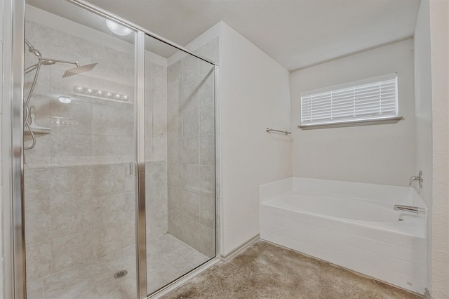 bathroom with shower with separate bathtub