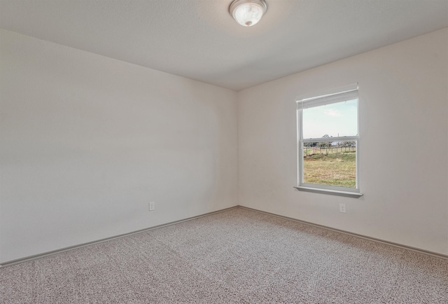 unfurnished room featuring carpet flooring