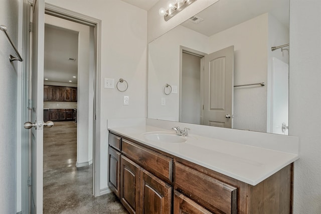 bathroom featuring vanity and concrete floors