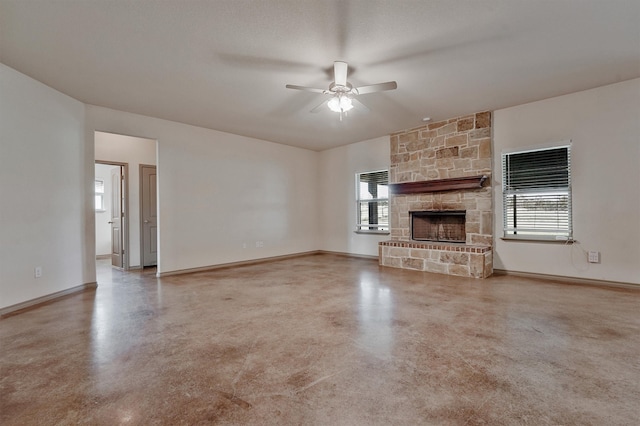 unfurnished living room featuring ceiling fan, a textured ceiling, and a fireplace