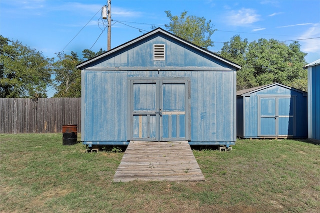 view of outdoor structure with a yard