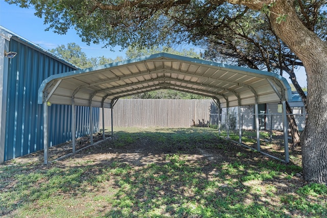 view of parking / parking lot featuring a carport