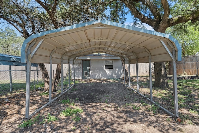 view of vehicle parking with a carport