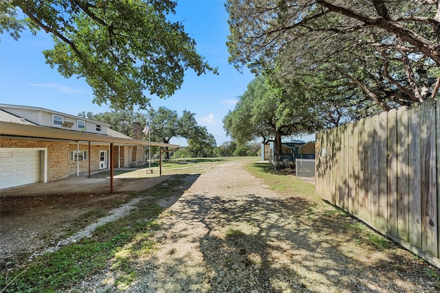 view of yard featuring a garage