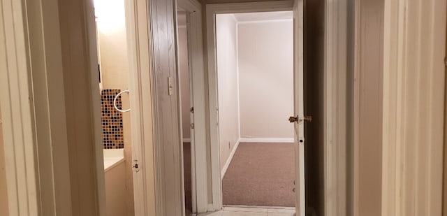 hall with carpet flooring