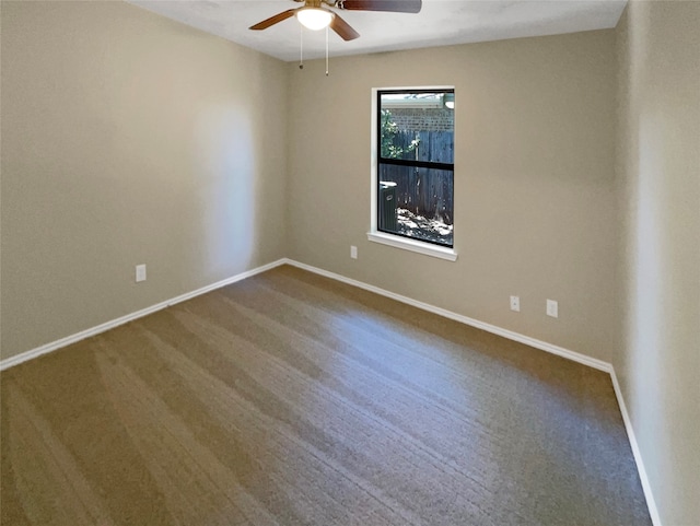 spare room with carpet floors and ceiling fan