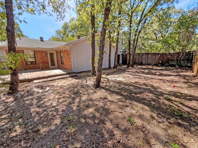 rear view of house featuring a deck