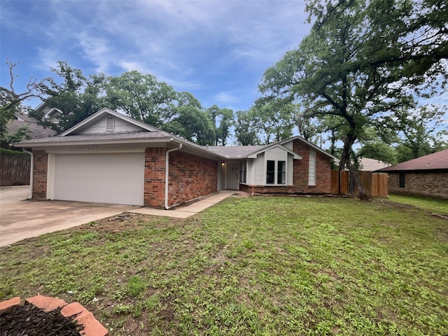 409 Misty Oaks St, Azle, TX 76020 - view of front of home featuring a garage, brick siding, and driveway