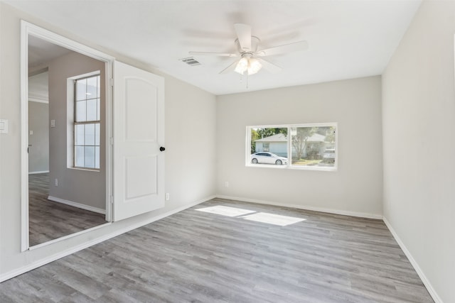 unfurnished room featuring ceiling fan and light hardwood / wood-style flooring