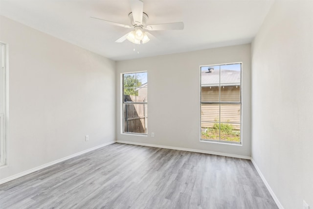 unfurnished room with ceiling fan and light hardwood / wood-style flooring