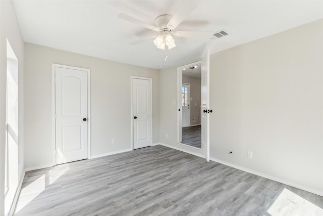 unfurnished bedroom with light hardwood / wood-style flooring and ceiling fan