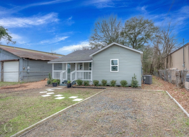 single story home with a front yard and central AC unit