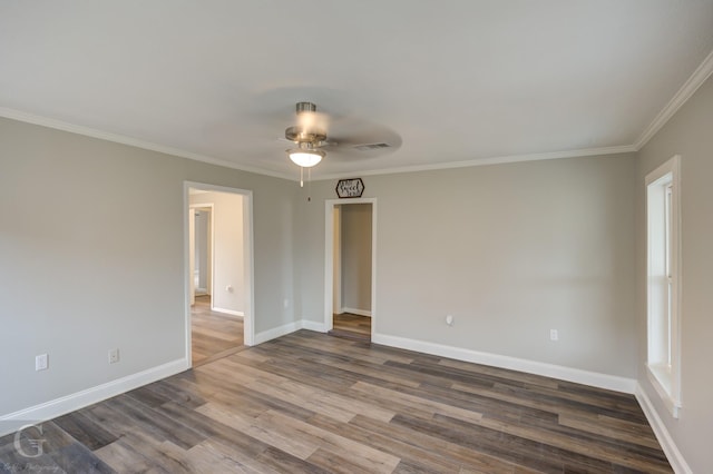 empty room featuring ceiling fan, wood-type flooring, and crown molding