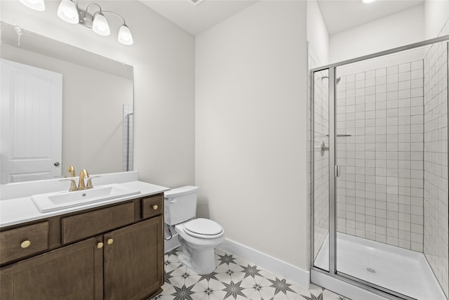 bathroom featuring an enclosed shower, vanity, and toilet