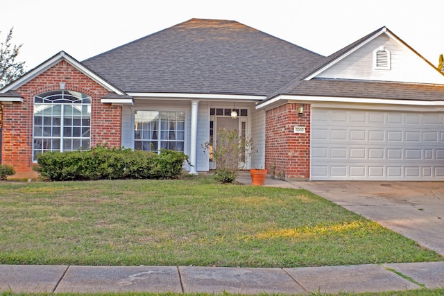 single story home with a front lawn and a garage