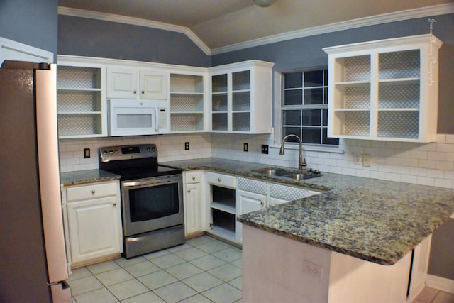 kitchen featuring fridge, kitchen peninsula, white cabinets, stainless steel electric range oven, and tasteful backsplash