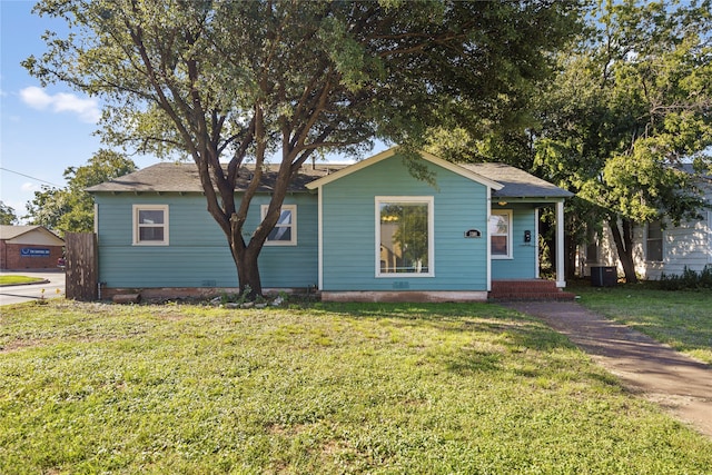 bungalow-style house featuring a front yard