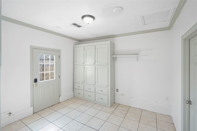 unfurnished bedroom with light tile patterned floors and crown molding