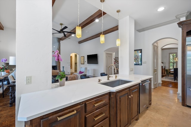 kitchen featuring light hardwood / wood-style floors, sink, beam ceiling, appliances with stainless steel finishes, and decorative light fixtures