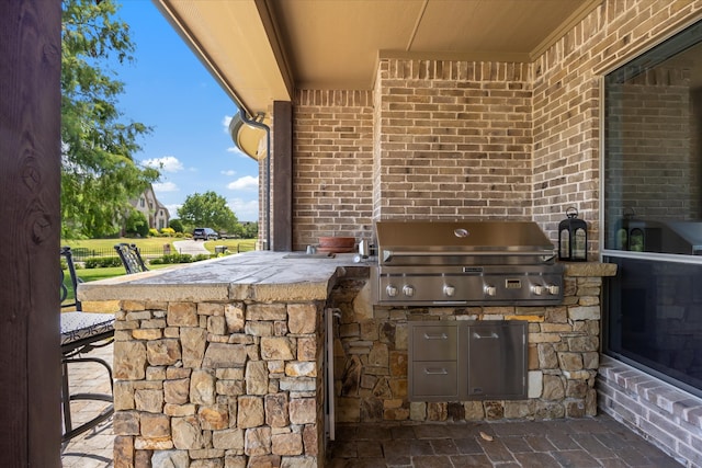 view of patio / terrace with area for grilling and exterior kitchen