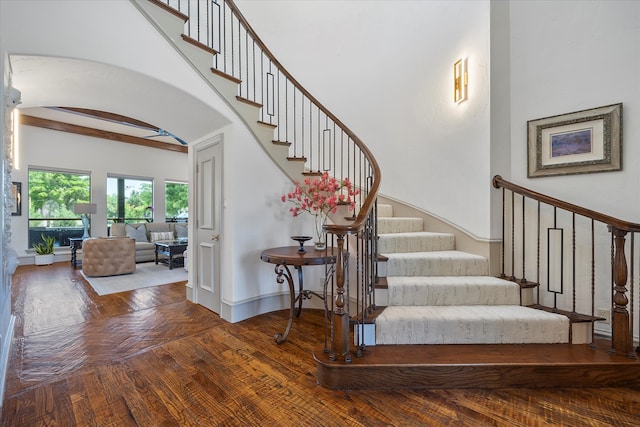 stairway with hardwood / wood-style floors