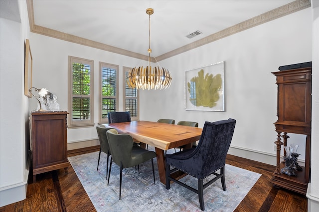 dining space featuring ornamental molding, dark hardwood / wood-style floors, and a chandelier