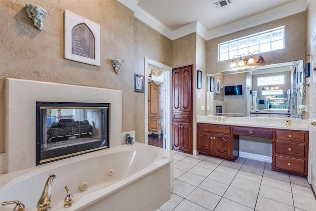 bathroom featuring vanity, tiled bath, crown molding, and tile patterned floors