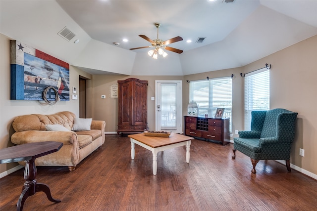 living room with lofted ceiling, ceiling fan, and dark hardwood / wood-style floors