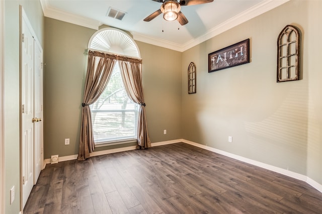 unfurnished room featuring ceiling fan, dark wood-type flooring, and crown molding