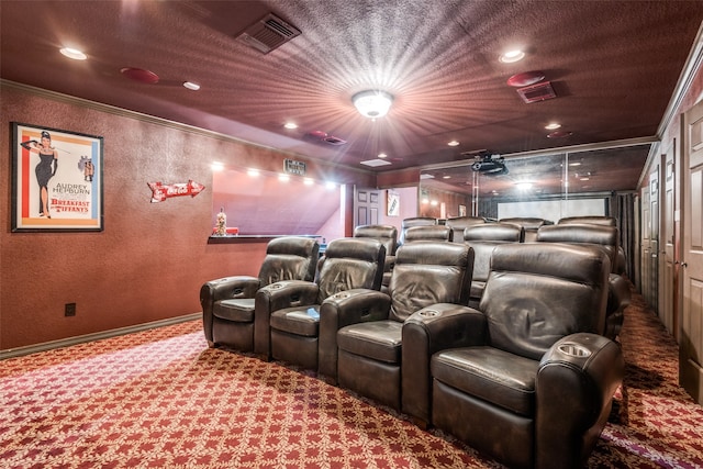 home theater room featuring carpet flooring and ornamental molding