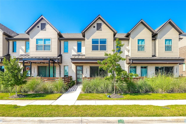 view of property with a front lawn