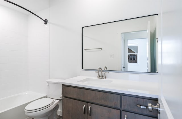 full bathroom featuring washtub / shower combination, vanity, and toilet