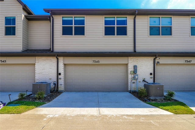 multi unit property with a garage and central AC