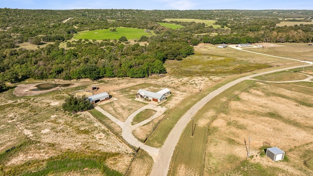 birds eye view of property featuring a rural view