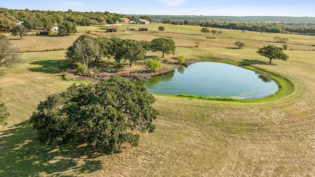 birds eye view of property with a water view and a rural view