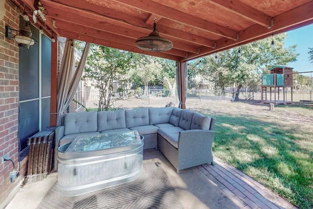 view of patio / terrace featuring a playground, an outdoor hangout area, and ceiling fan