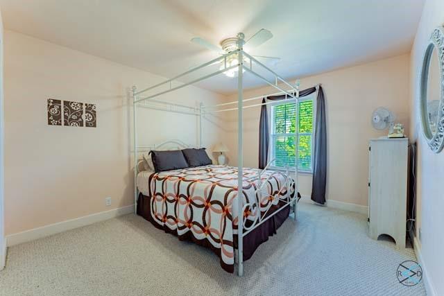 bedroom featuring carpet floors and ceiling fan