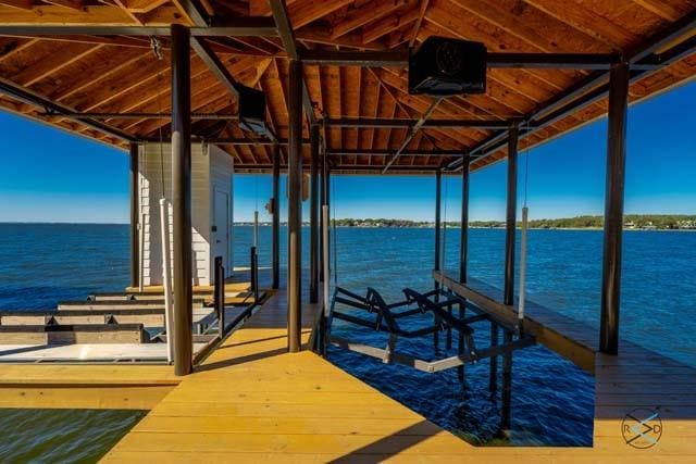 dock area featuring a water view and boat lift