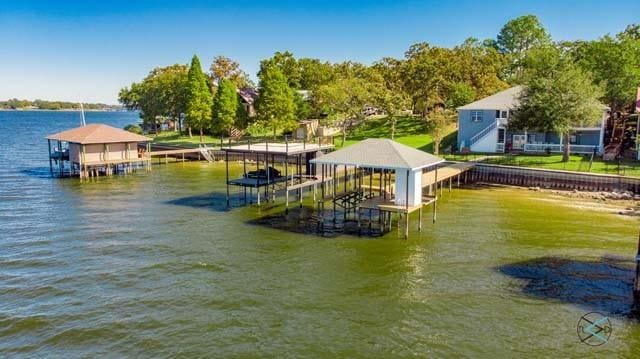 view of dock featuring a water view and boat lift