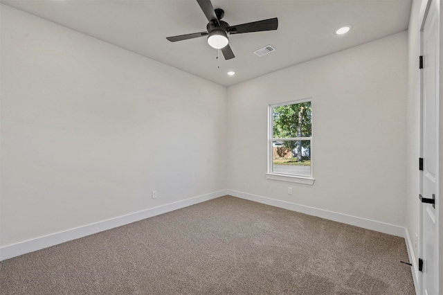 empty room with carpet floors and ceiling fan