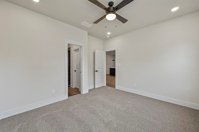 unfurnished bedroom with ceiling fan and carpet floors