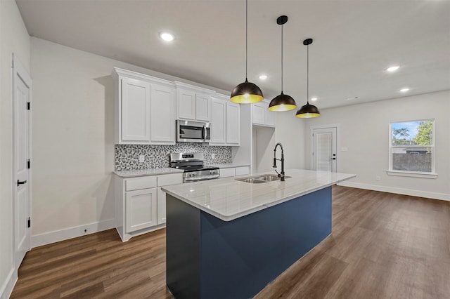 kitchen with stainless steel appliances, dark hardwood / wood-style floors, sink, and white cabinetry