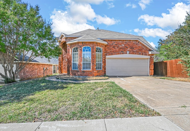 view of front property featuring a front yard and a garage